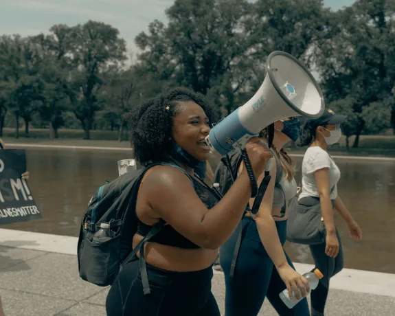 Student speaking into microphone.