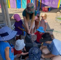 Making mud and planting seeds using soil blockers